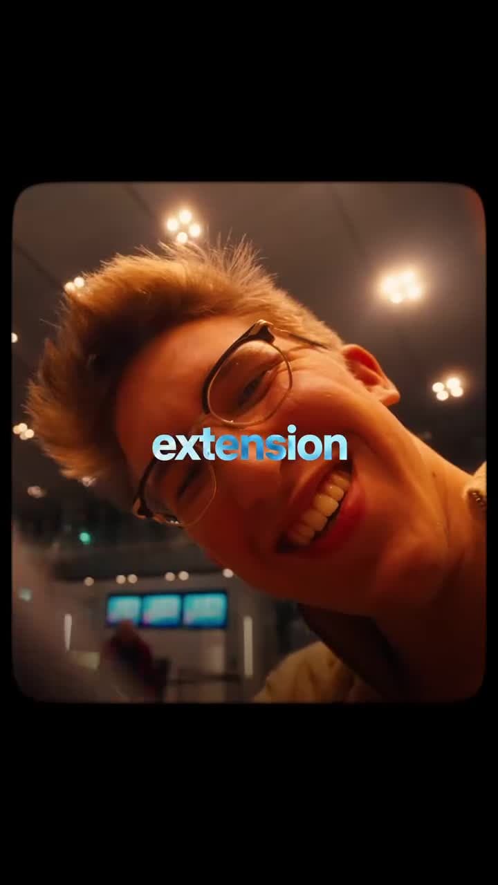Founder smiling to camera under warm neon lighting in a vertical personal-brand reel